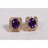 A pair of amethyst and diamond earrings set in 14ct mounts