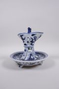 A Chinese Ming style yellow ground blue and white porcelain Jue (wine vessel) and stand decorated