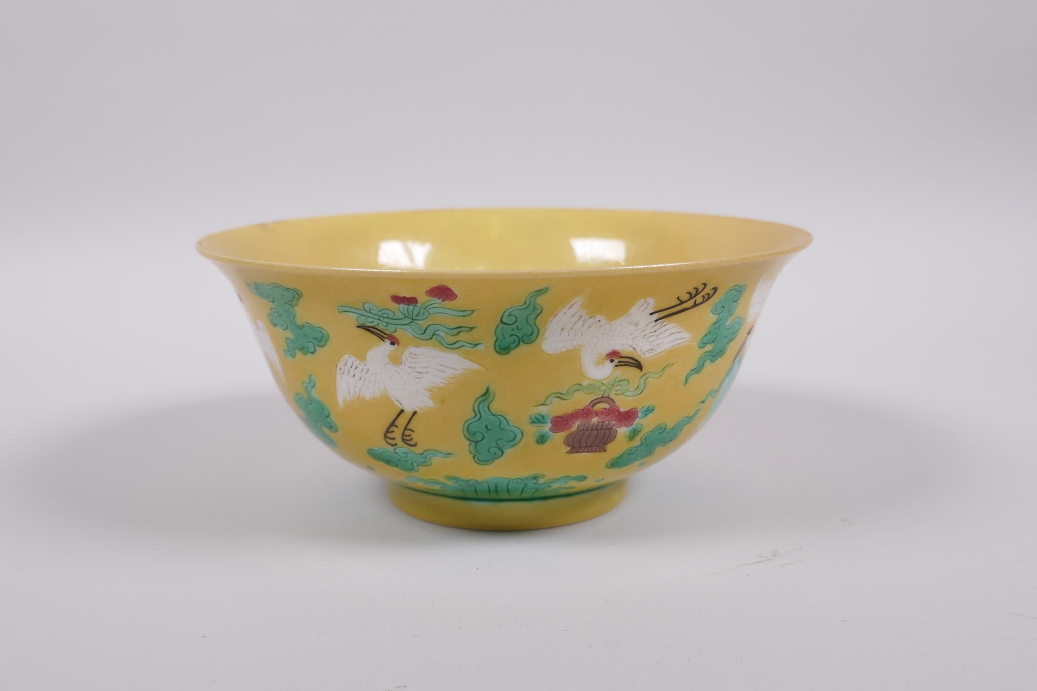 A Chinese yellow ground porcelain rice bowl decorated with red crowned cranes in flight, 6 character - Image 5 of 8