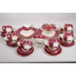 An early C20th Paragon bone china twelve place setting tea service with teapot, cream jug, sugar