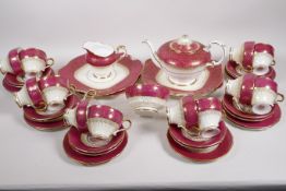 An early C20th Paragon bone china twelve place setting tea service with teapot, cream jug, sugar