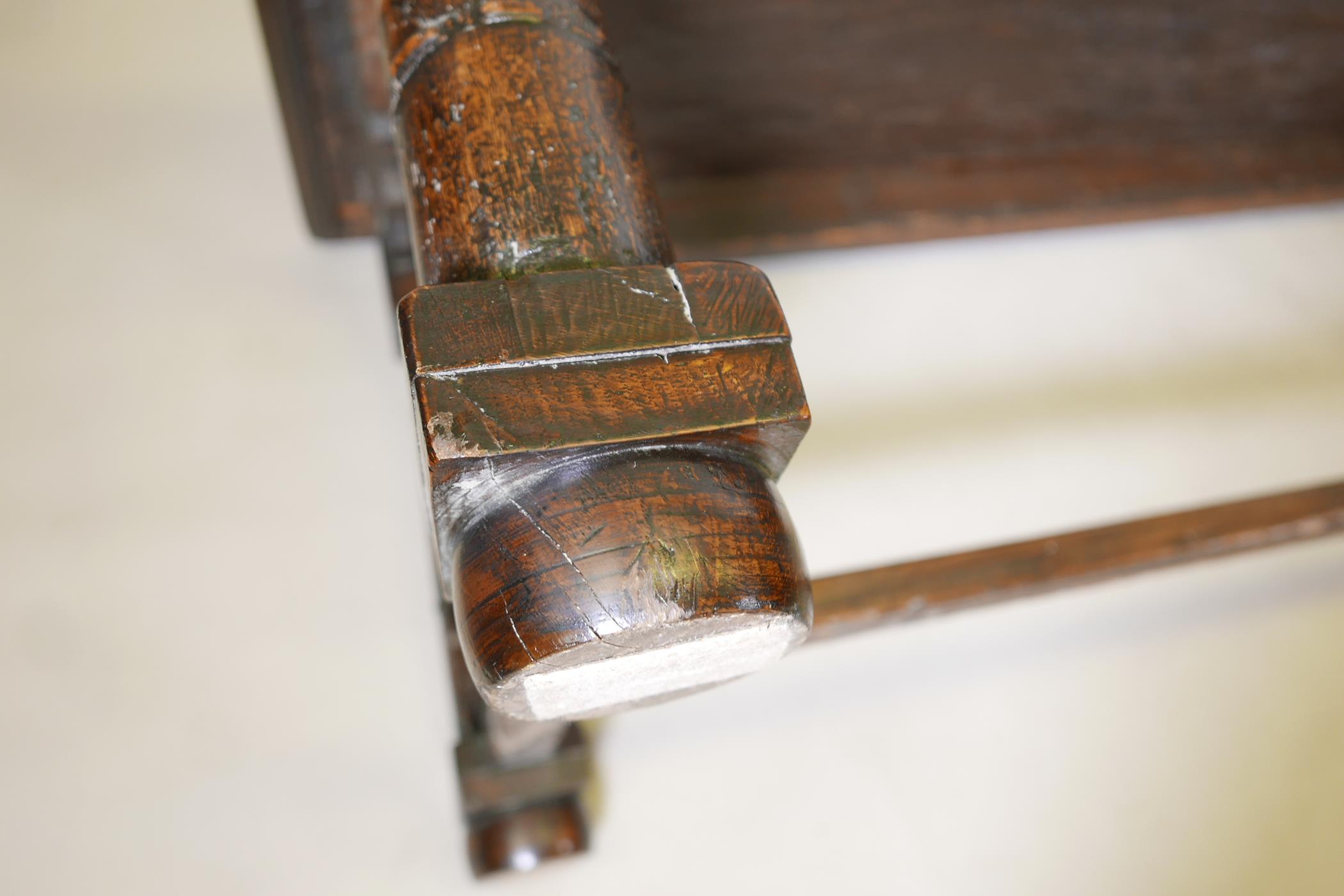 An antique oak refectory table, with plank top and carved frieze raised on gun barrel turned - Image 8 of 9