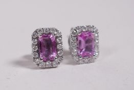A pair of 18ct white gold, pink sapphire and diamond earrings, 1.57cts