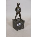A bronze figure of a young boy on skis, impressed Ferdinand Paris, with a foundry mark, BJB,