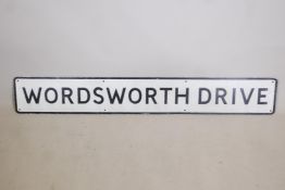 A painted metal road sign, 'Wordsworth Drive', 62" x 9"