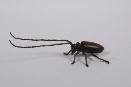 A Japanese Jizai style bronzed metal beetle with articulated limbs, antennae and carapace, 5½" long