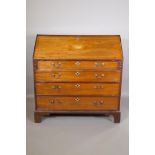 George III inlaid mahogany fall front bureau with fitted interior over four long drawers with