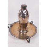 An Art Deco silver plated cocktail shaker on fitted tray, Walker and Hall, Sheffield, 9½" diameter,