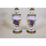 A pair of C19th porcelain and gilt metal mounted lamps, with hand painted grape and vine decoration,