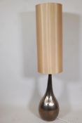A bottle shaped lustre ware floor lamp, with tubular shade, 50" high overall