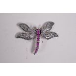 A 925 silver brooch in the form of a dragonfly with articulated wings set with marcasite, and the
