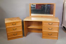 A G-Plan three drawer mirror back dressing table and matching chest of three drawers, designed by E.