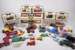 A collection of toys including early Dinky, Corgi boxed Yesteryear commercial vehicles etc