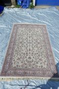 A fine woven beige ground full pile Iranian carpet with an all over floral pattern, 118" x 78"