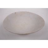 A Song pottery shallow bowl with engraved decoration, unglazed, Chinese, 7" diameter, A/F