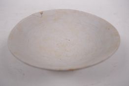 A Song pottery shallow bowl with engraved decoration, unglazed, Chinese, 7" diameter, A/F