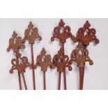 Eight metal plant stakes with Gothic style cast iron tops, 42" long