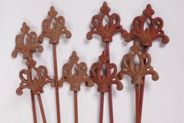 Eight metal plant stakes with Gothic style cast iron tops, 42" long