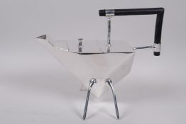 An Art Deco style silver plated teapot in the style of Christopher Dresser, raised on four slender