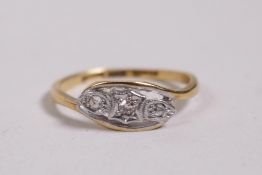 An 18ct yellow gold and platinum three stone diamond ring, approximate size 'N'