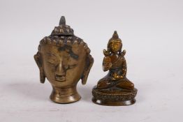 A small Tibetan bronze Buddha head and a bronze of Buddha seated on a lotus throne, 3½" high