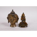 A small Tibetan bronze Buddha head and a bronze of Buddha seated on a lotus throne, 3½" high