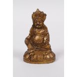 A Sino-Tibetan gilt bronze figure of a wrathful deity, 2½" high