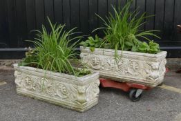 A pair of reconstituted stone garden planters, 28" x 9" x 10½"