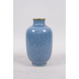 A light blue glazed porcelain vase with gilt rims and incised prunus blossom decoration, Qianlong