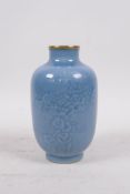 A light blue glazed porcelain vase with gilt rims and incised prunus blossom decoration, Qianlong