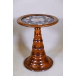 A South American oyster veneered occasional table, with inset glass top with butterfly and