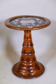 A South American oyster veneered occasional table, with inset glass top with butterfly and