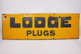 A vintage 'Lodge Plugs' enamel metal sign, circa 1920, 36" x 12"