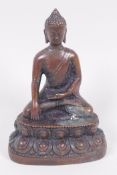 A small Chinese bronze figure of Buddha seated in meditation on a lotus throne, 3½"