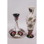 A Moorcroft pottery vase of compressed form, decorated with poppies and daisies, signed, 6" high,