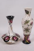 A Moorcroft pottery vase of compressed form, decorated with poppies and daisies, signed, 6" high,