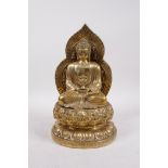 A Chinese gilt bronze of Buddha seated on a lotus throne, 4 character mark to base, 11" high