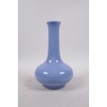 A Chinese light blue glazed porcelain bottle vase, of squat form, 6 character mark to base, 8½" high