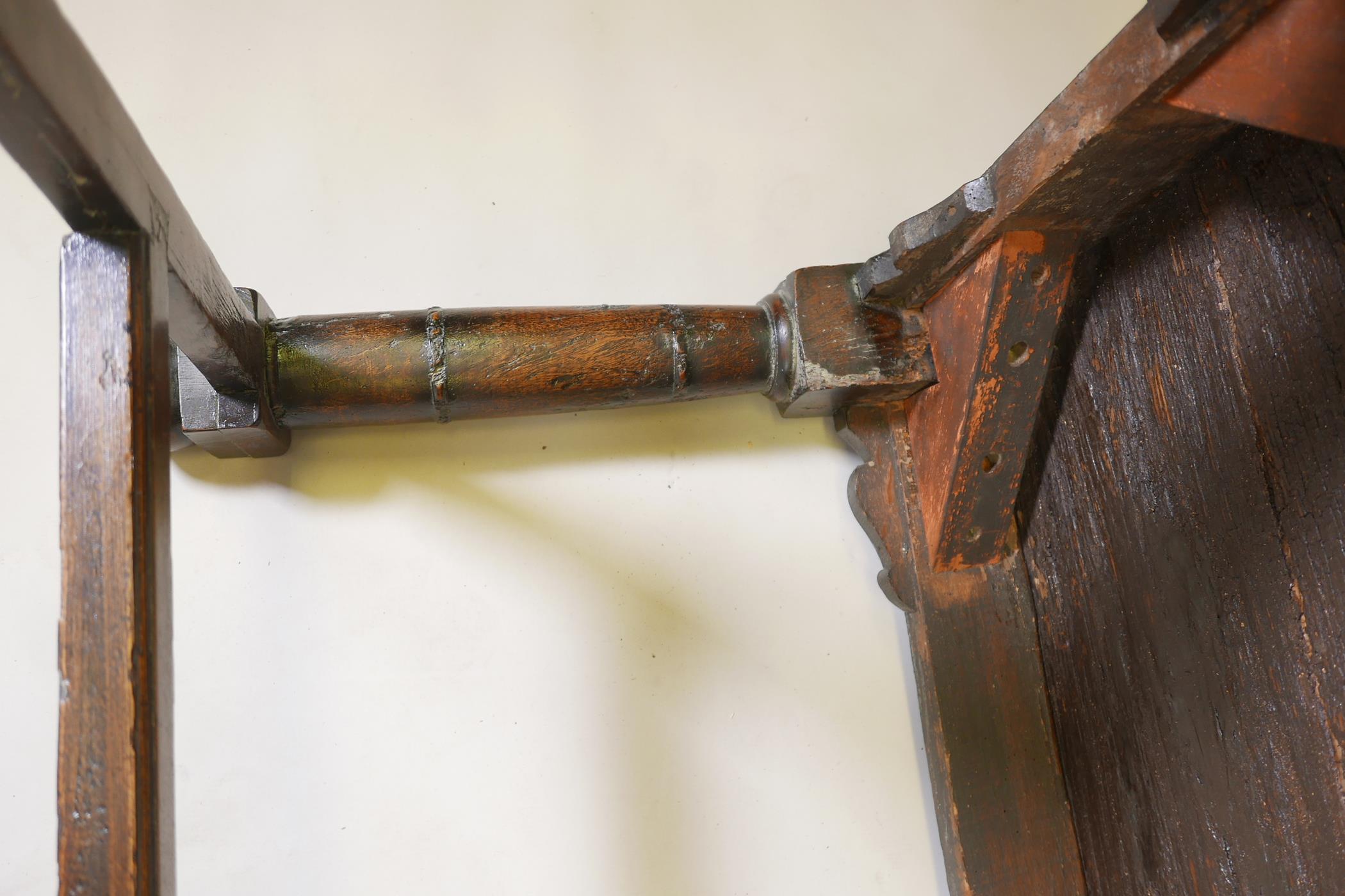An antique oak refectory table, with plank top and carved frieze raised on gun barrel turned - Image 7 of 9