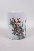 A Chinese famille verte porcelain brush pot decorated with birds, butterflies and flowers, Kangxi