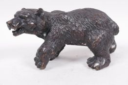 A small bronze figure of a brown bear, 6½" long