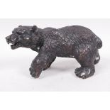 A small bronze figure of a brown bear, 6½" long