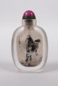 A Chinese reverse decorated glass snuff bottle depicting horses, 4" high