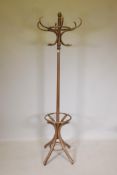 A bentwood stick and coat rack