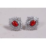 A pair of silver, cubic zirconium and fire style opal earrings