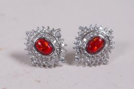 A pair of silver, cubic zirconium and fire style opal earrings