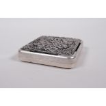 A Sino-Tibetan white metal incense box and cover, with auspicious symbol and lotus flower decoration