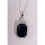 A 925 silver and large faux sapphire pendant necklace encircled by cubic zirconium, 1½" drop