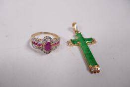 A 10ct yellow gold, diamond and ruby ring, size N/O, and an 18ct gold and jade crucifix