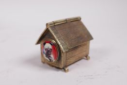 A brass vesta case in the form of a dog kennel, 2" long